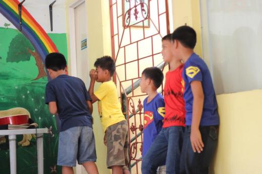 The kids are preparing for their group yells.